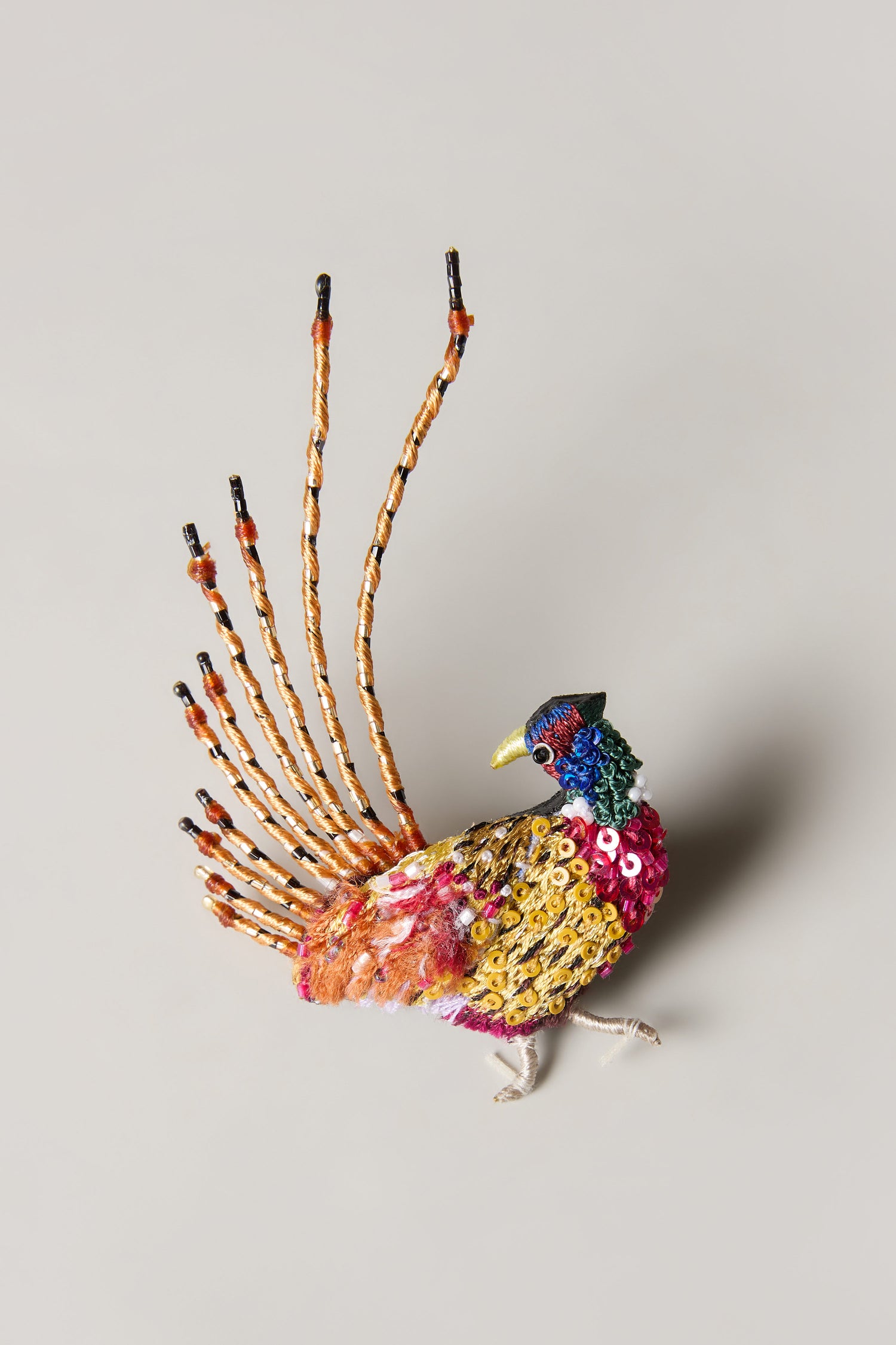 The Hand Beaded Pheasant Brooch features a colorful beaded bird with sequined accents and long tail feathers—an ideal gift for nature lovers and a unique addition to any brooch collection.
