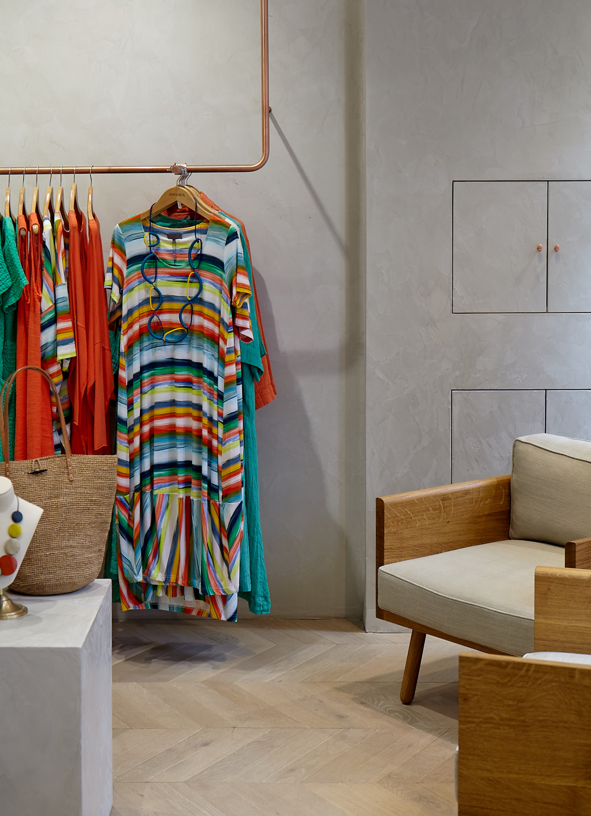 clothing hanging in a sahara shop with chairs