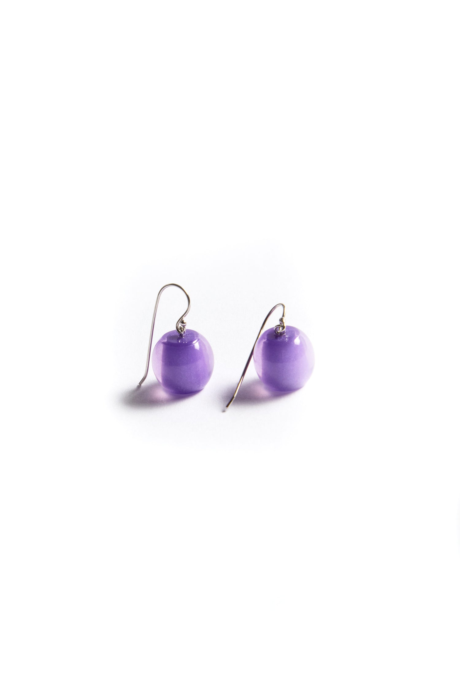 Part of the Bellisima Collection, the Colourful Bead Earrings are elegant purple drops with shimmering resin beads and silver hooks, beautifully displayed on a white background.