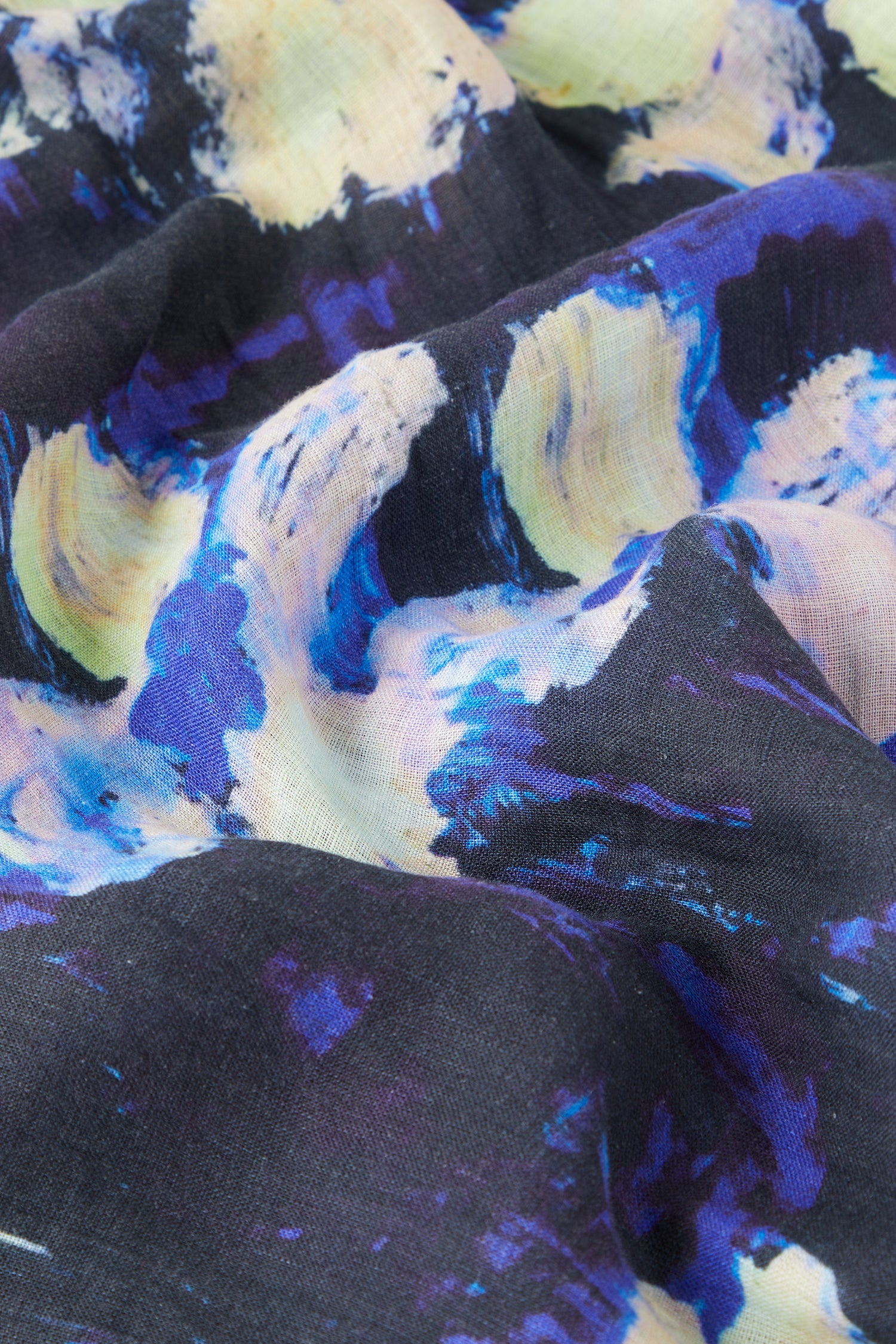 Close-up of a Floral Linen Dress with a vibrant blue, yellow, and black floral print.