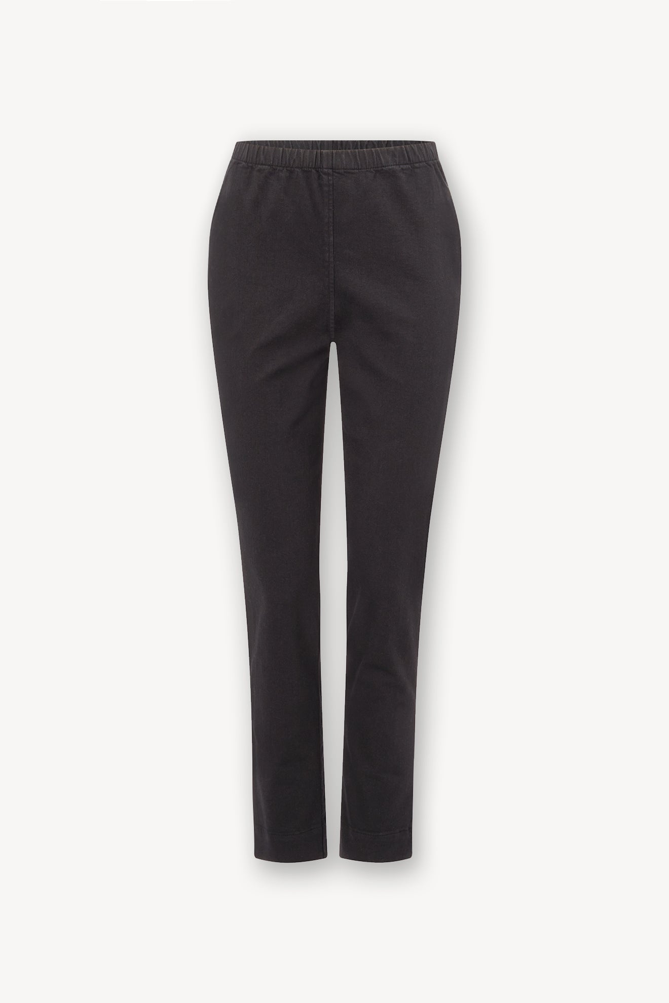 Black stretch twill cotton trousers with an elastic waist, isolated on a white background.