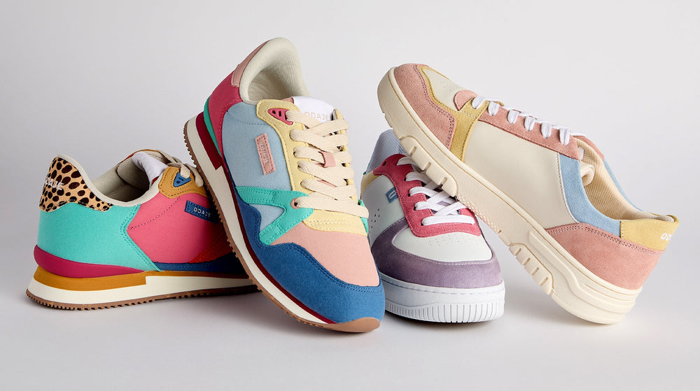 Four colorful sneakers with various textures and patterns, including leopard print and pastel hues, arranged against a plain background.