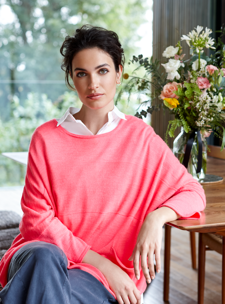 woman in a pink jumper