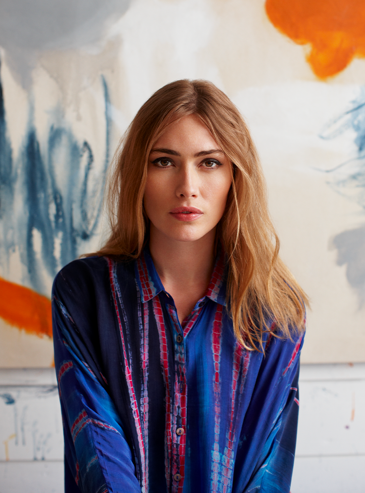 woman in a blue and red patterned shirt