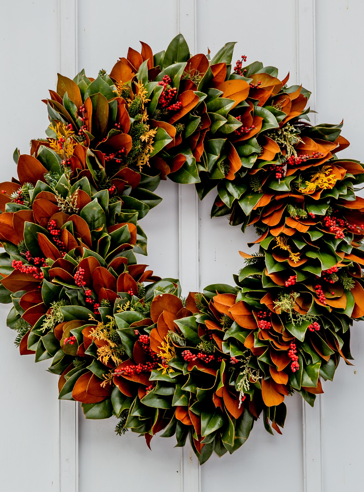 green and orange door wreath 