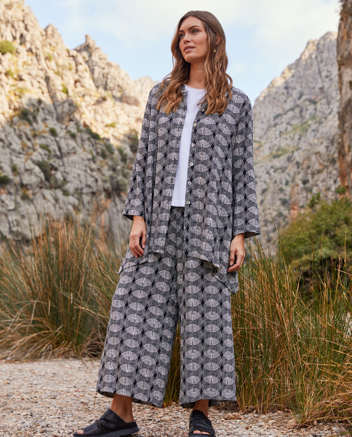 woman wearing a blue patterned trouser and shirt