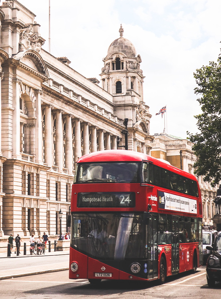 red bus driving through london