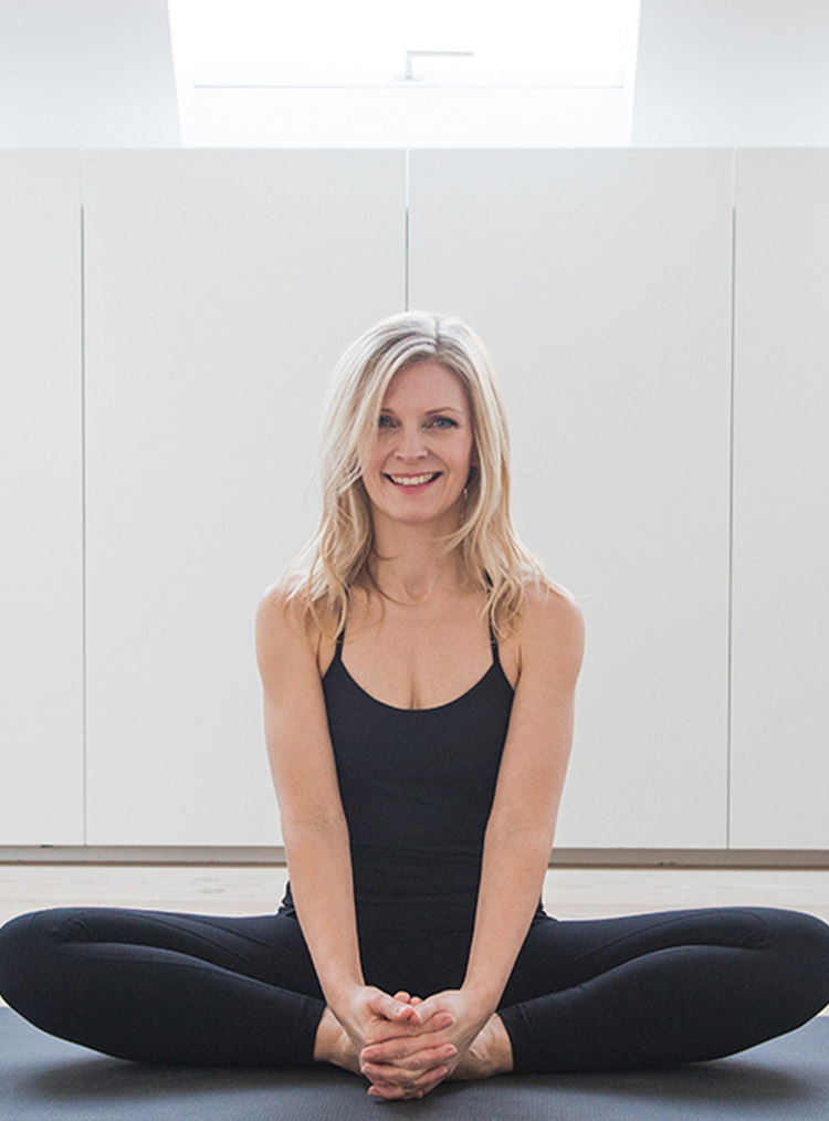 woman sat in a yoga pose