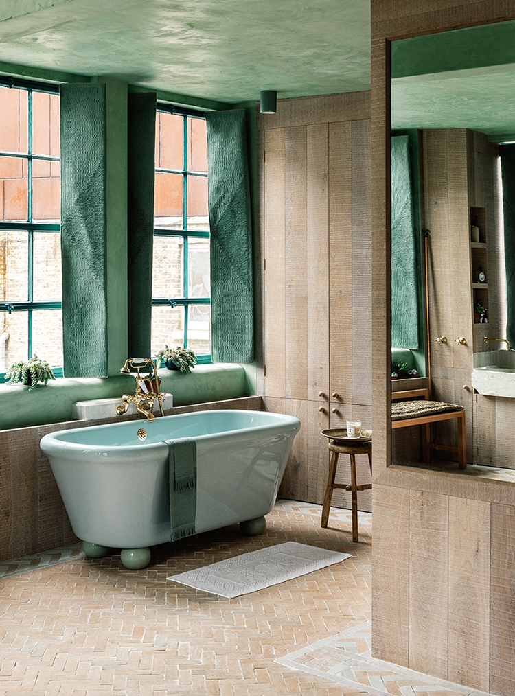 green bath in a wooden theme bathroom