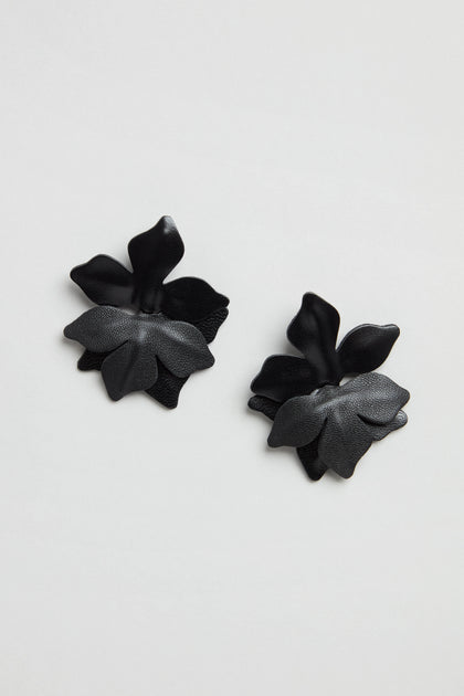 Metallic Leather Flower Earrings in black, featuring layered petal designs, are shown against a plain white background.