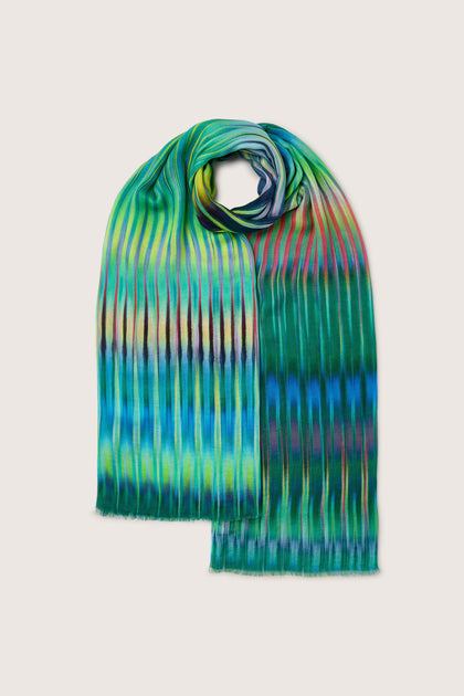 A lightweight Ikat Zig Zag Scarf with a vibrant blue pattern.