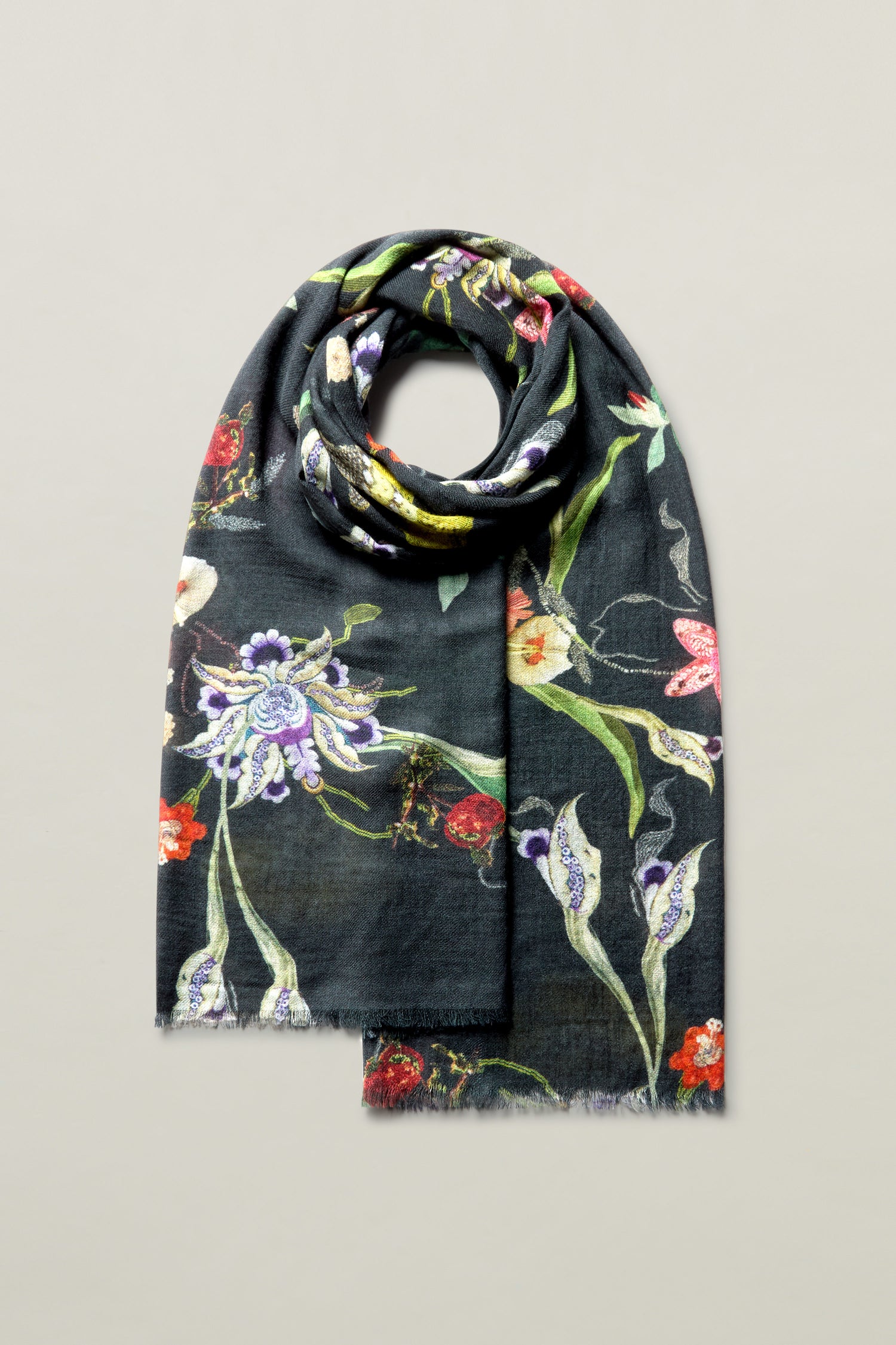 The Vintage Floral Wool Scarf is artfully rolled and displayed against a plain background, highlighting its luxurious botanical print.