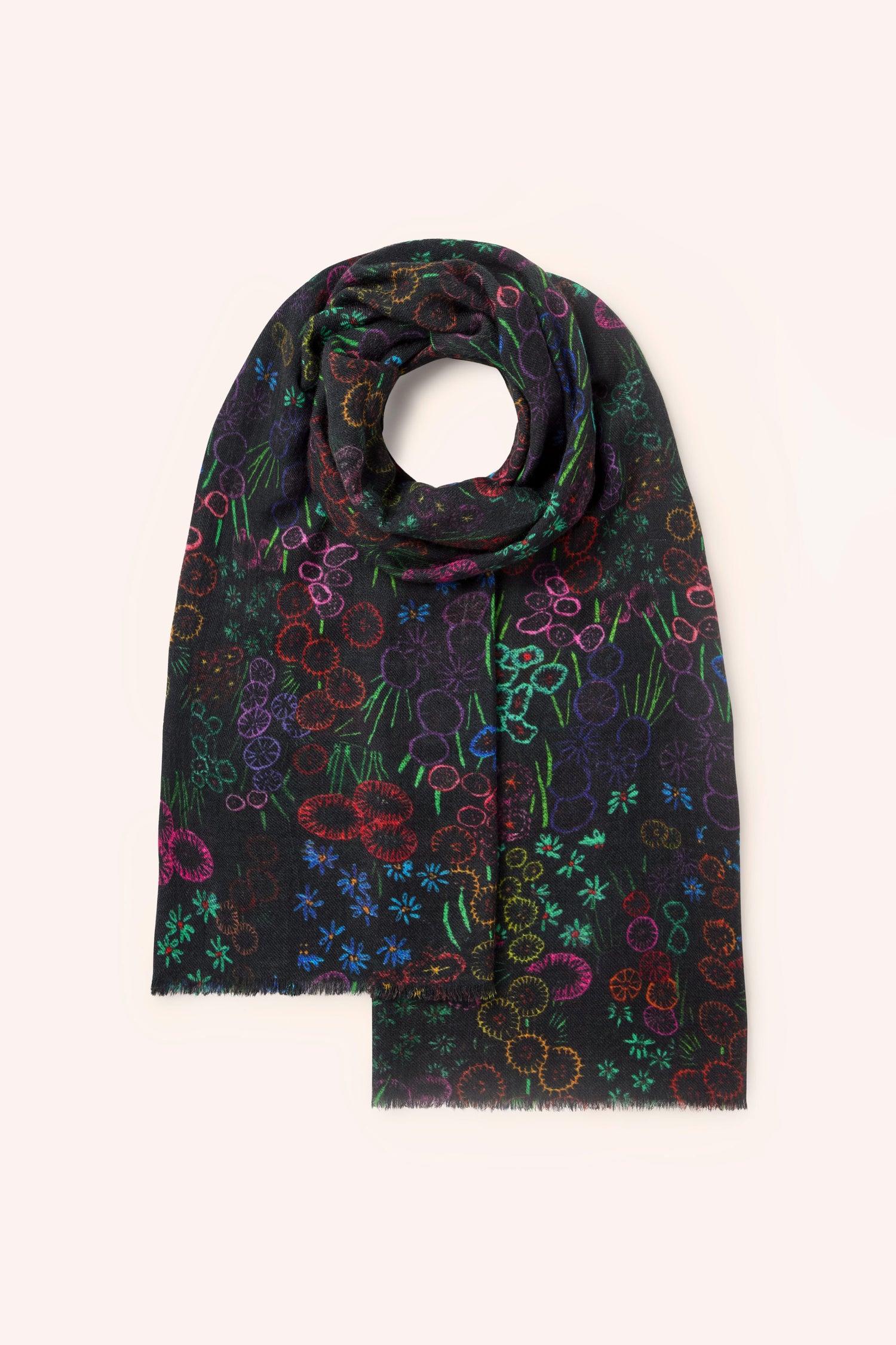 A Winter Floral Wool Scarf in black, adorned with vibrant floral patterns, elegantly arranged in a circular form with one end gracefully draping downward.