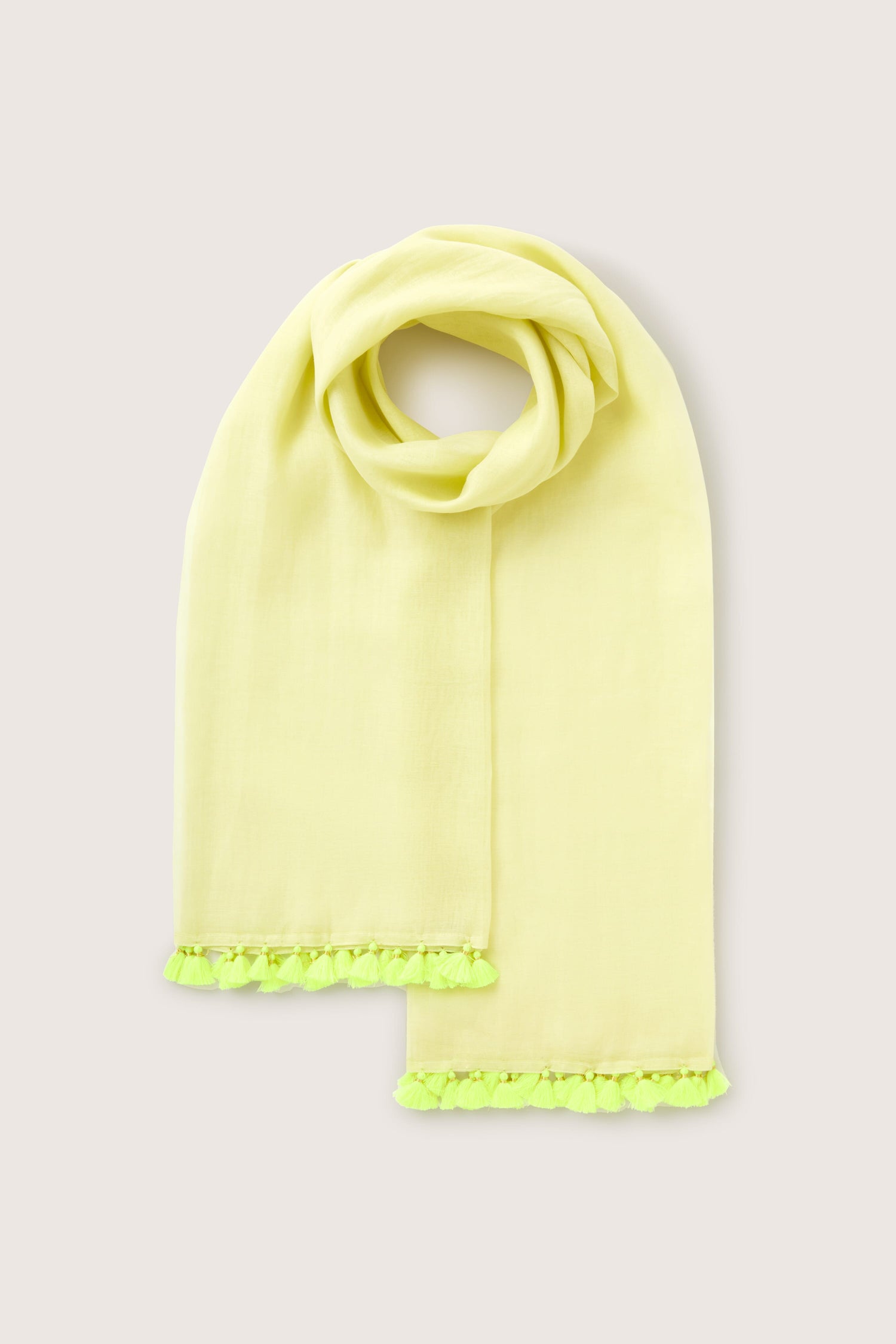 A light yellow Neon Tassel Scarf with green tassel trim, neatly displayed on a plain background.