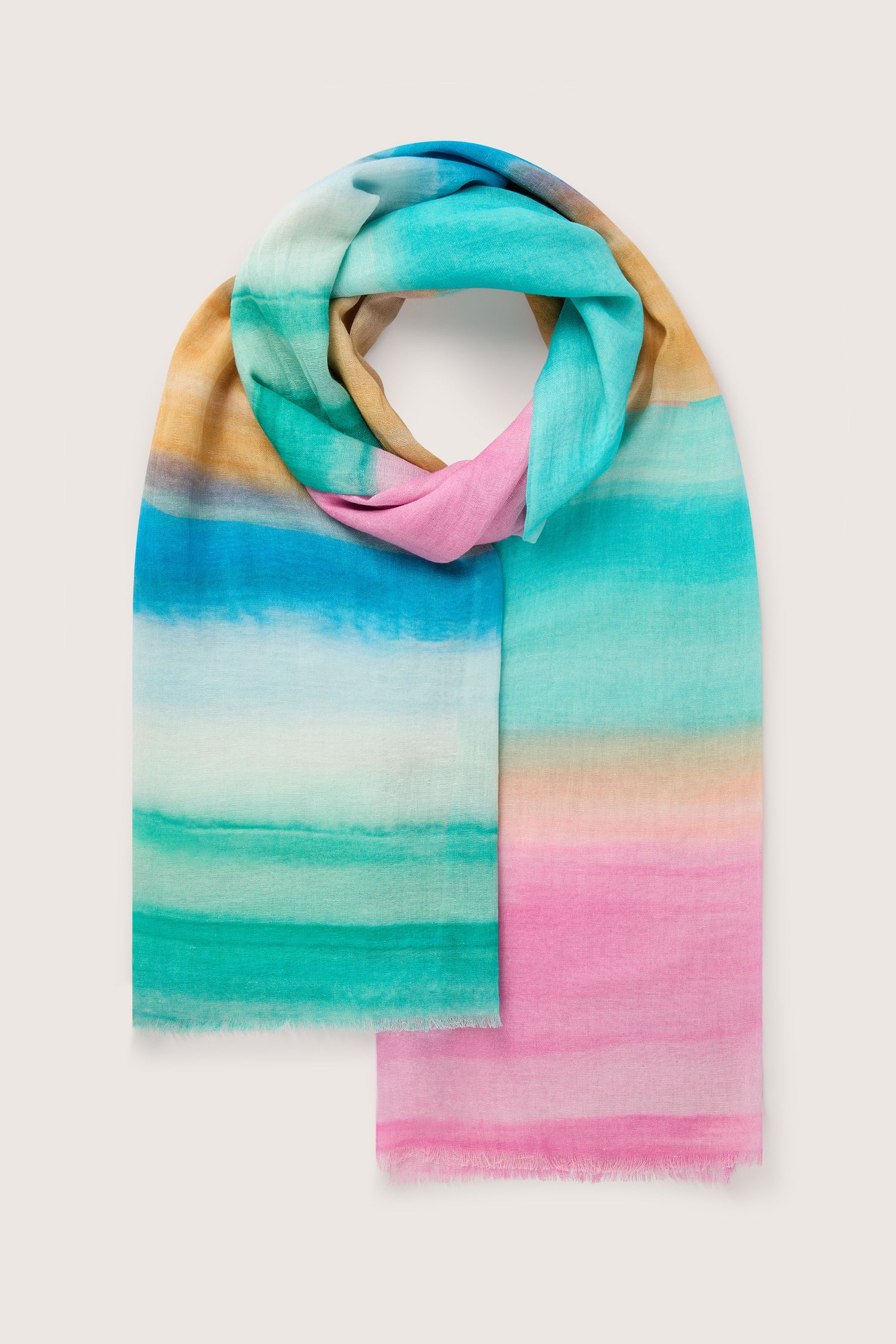 The Colour Fusion Scarf is a rectangular accessory with a soft gradient of blue, teal, pink, and yellow hues, neatly folded on a plain background—perfect for elevating your summer style.