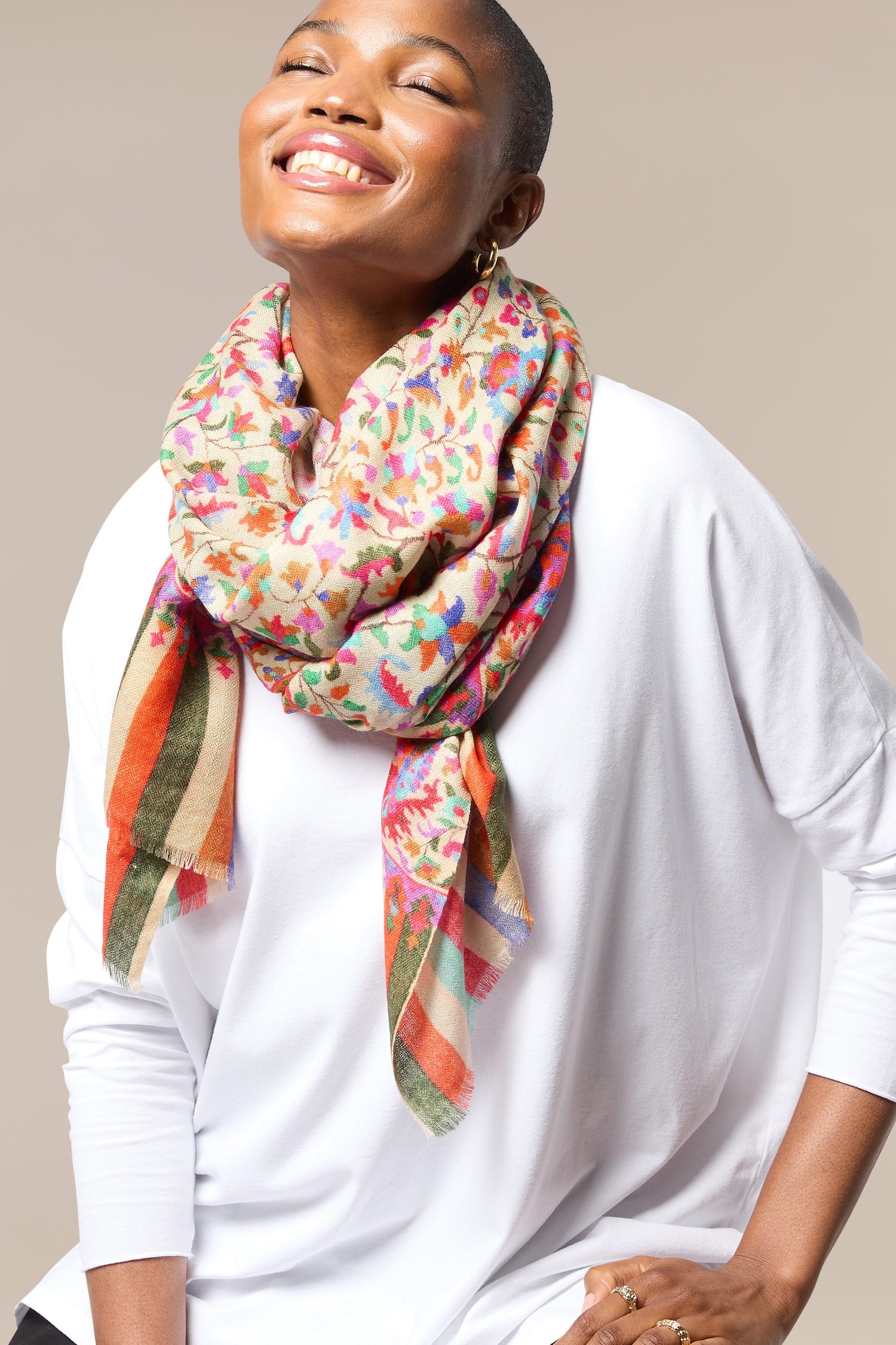 A woman wearing an Antique Floral Woollen Scarf.