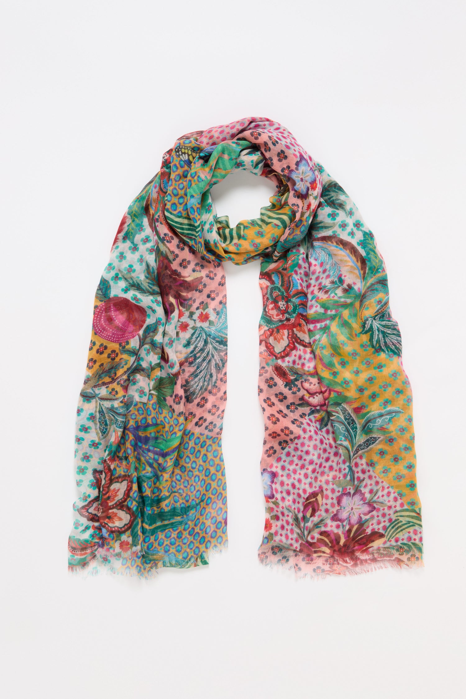 The Botanical Patchwork Scarf blends floral, botanical, geometric, and polka dot patterns in vibrant hues. Lightweight and colorful, it’s the perfect accessory to elevate your everyday look.