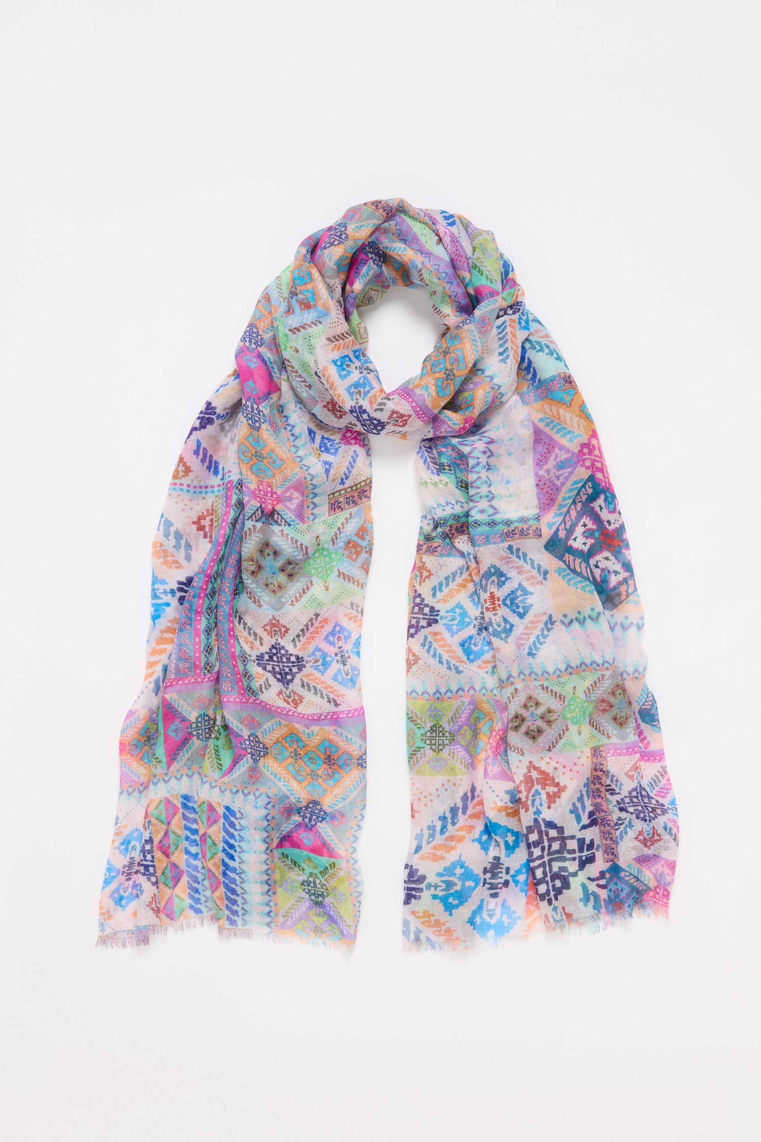 The Modern Mosaic Scarf showcases elegant geometric and floral designs arranged on a flat white background.
