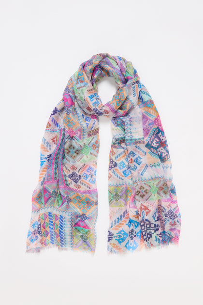 The Modern Mosaic Scarf showcases elegant geometric and floral designs arranged on a flat white background.