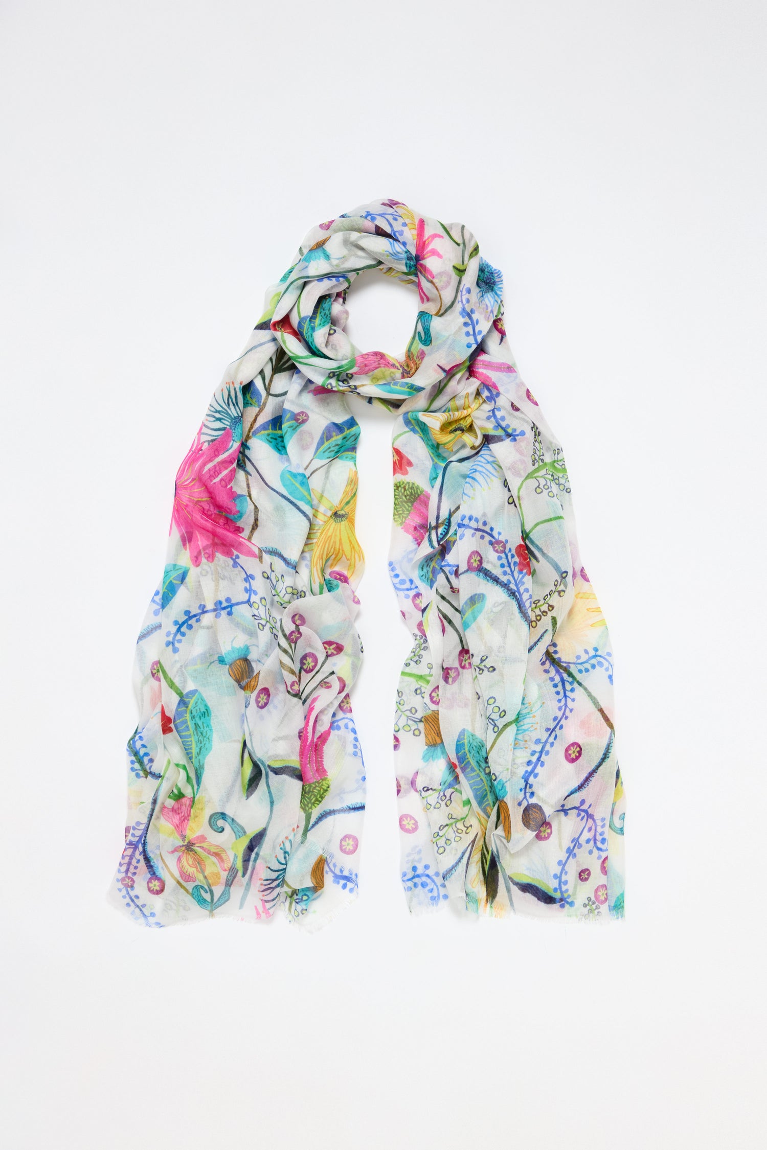 Introducing the Wild Garden Scarf, a lightweight accessory with a vibrant floral design featuring pink, yellow, and blue flowers with lush green leaves on a white background.
