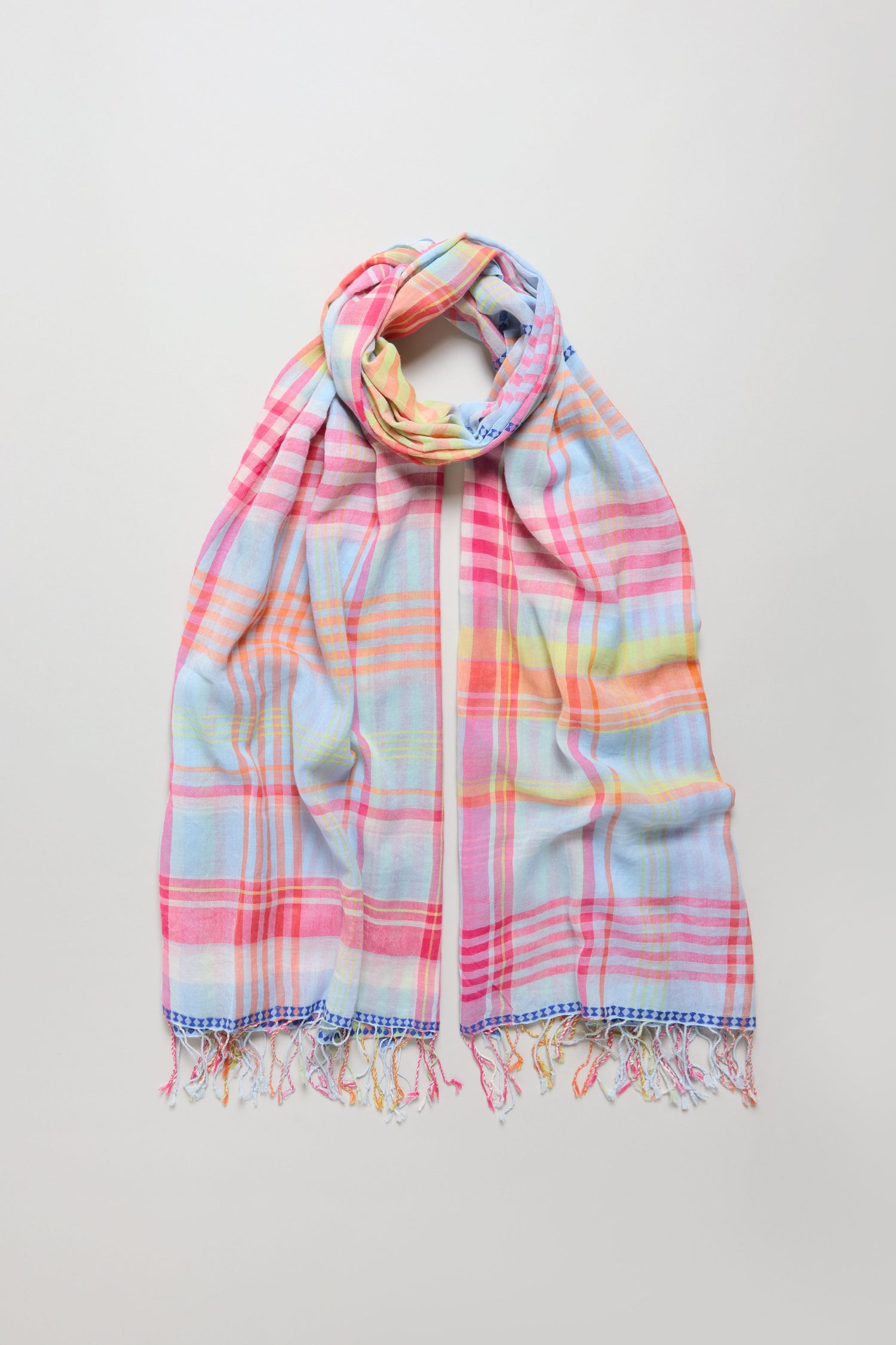 The Blue Check Stitch Cotton Scarf is a lightweight cotton accessory with pastel plaid in pink, blue, yellow, and orange, delicate check stitch details, and fringed edges—perfect for versatile styling on any occasion.