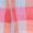 A close-up of the Blue Check Stitch Cotton Scarf, featuring a checkered cotton pattern in shades of red, pink, blue, and white.