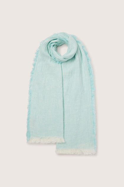A light blue scarf with fringes and a Vintage Linen Scarf on a white background.