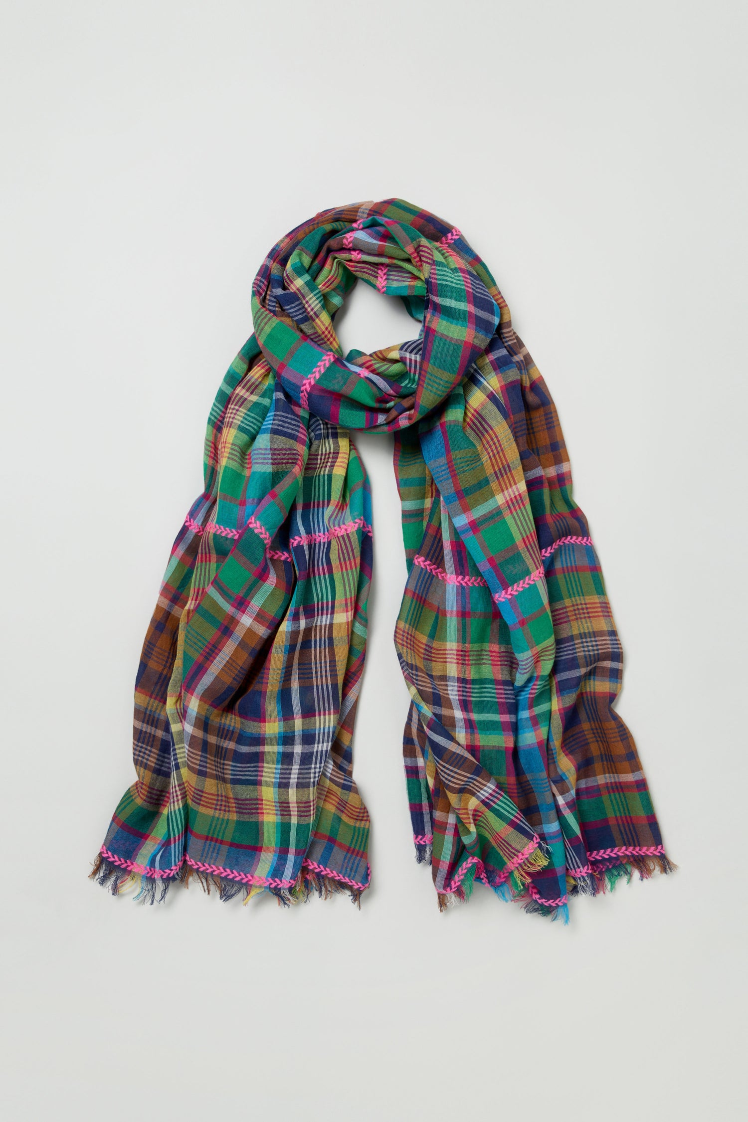 The Fuchsia Embroidered Check Scarf, a cotton blend with multicolored checks and fringed edges, features vibrant green, blue, yellow, and red tones—perfect for adding a lively accent to any outfit.