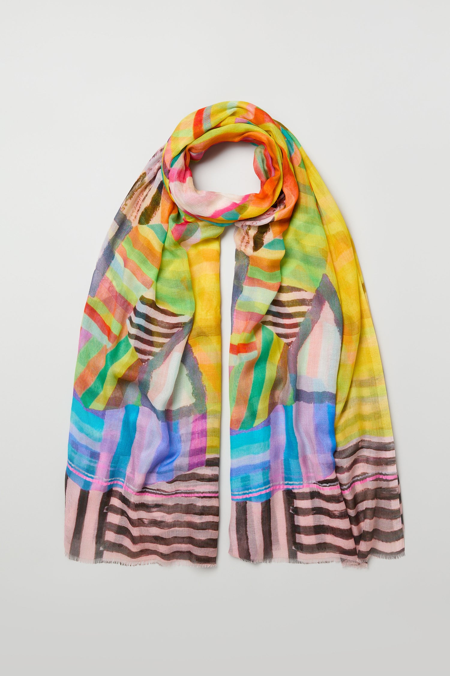 The Directional Stripe Modal Blend Scarf is a lightweight, colorful accessory with directional stripes in yellow, green, blue, pink, red, and black, shown laid flat on a white background.