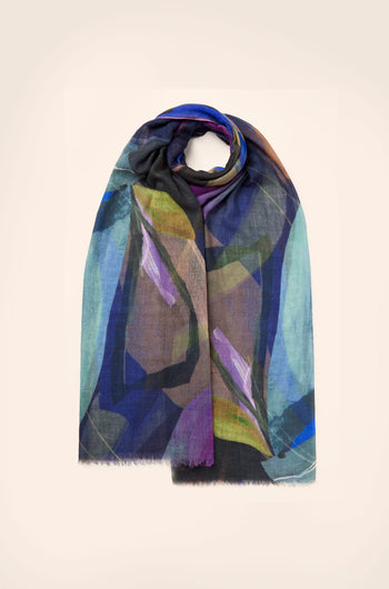 The Abstract Plume Wool Scarf features a hand-painted design with abstract geometric patterns in blue, green, purple, and brown shades against a plain background. Made from premium wool, it offers ultimate comfort and style.