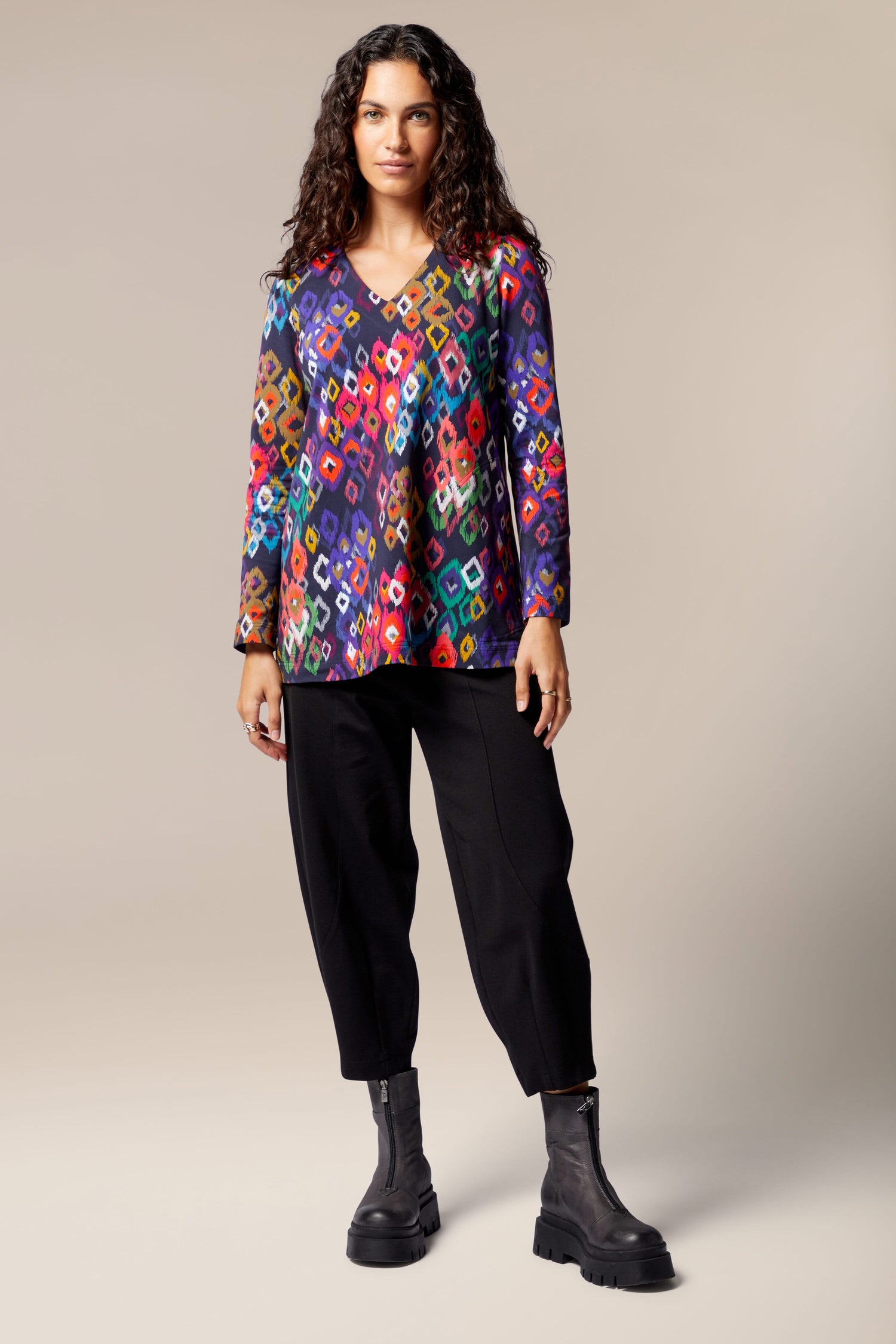 A woman wearing a Tanza Top inspired by Finnish tradition.