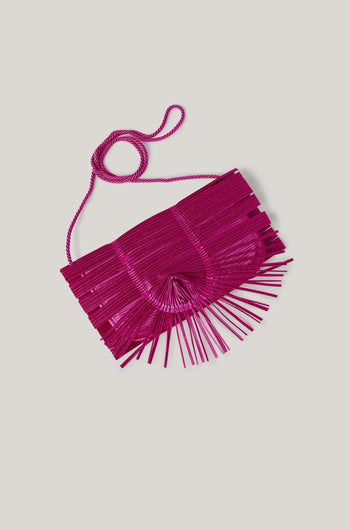 A versatile Pleated Clutch with fringes, designed by Alexandra Tsoukala.