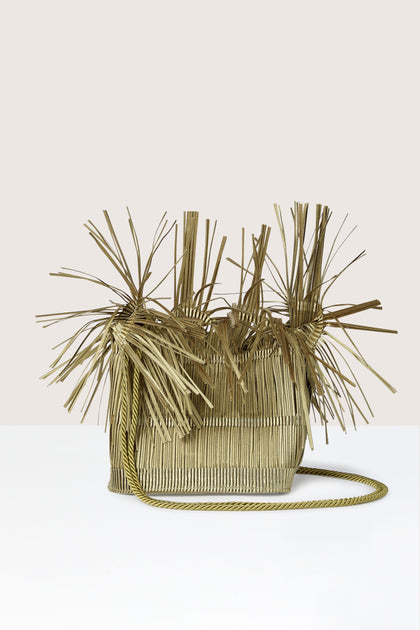 The versatile wear pleated handbag designed by Alexandra Tsoukala is embellished with a chain for added style.