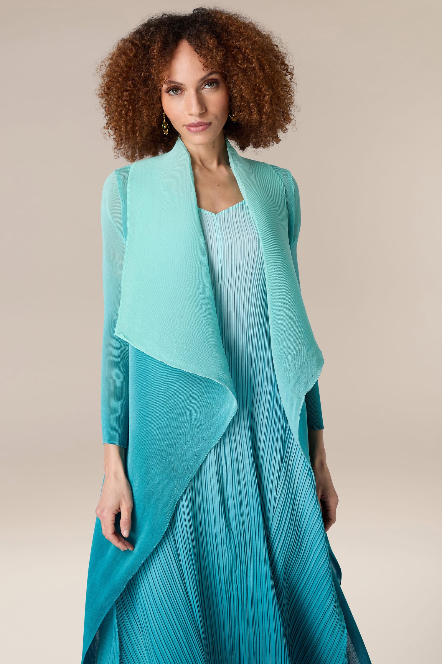A woman wearing a pleated jacket.