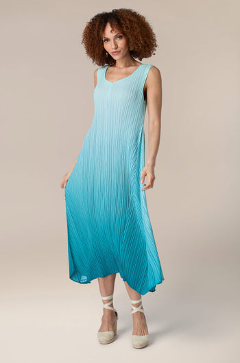 A woman wearing a blue Pleat Dress.