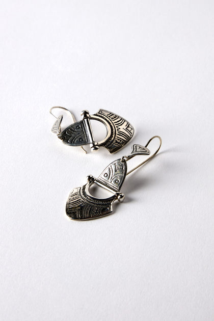 The Engraved Silver Tuareg Earrings feature intricate patterns on a plain white background, ideal for adding a bohemian touch to your jewelry collection.