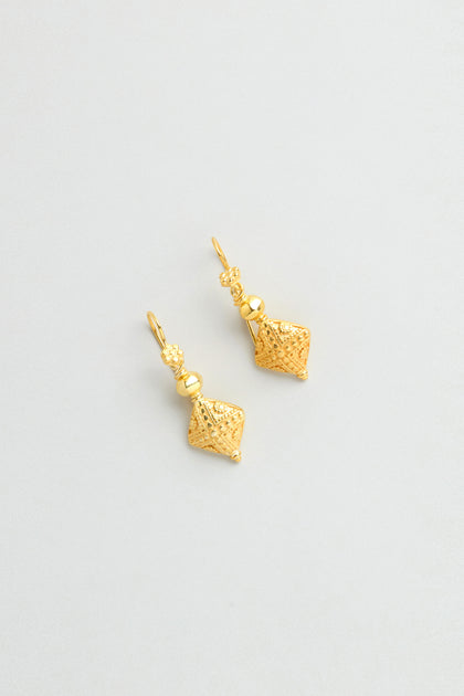 The Gold Vermeil Faceted Drop Earrings feature textured geometric pendants and are shown against a light background.
