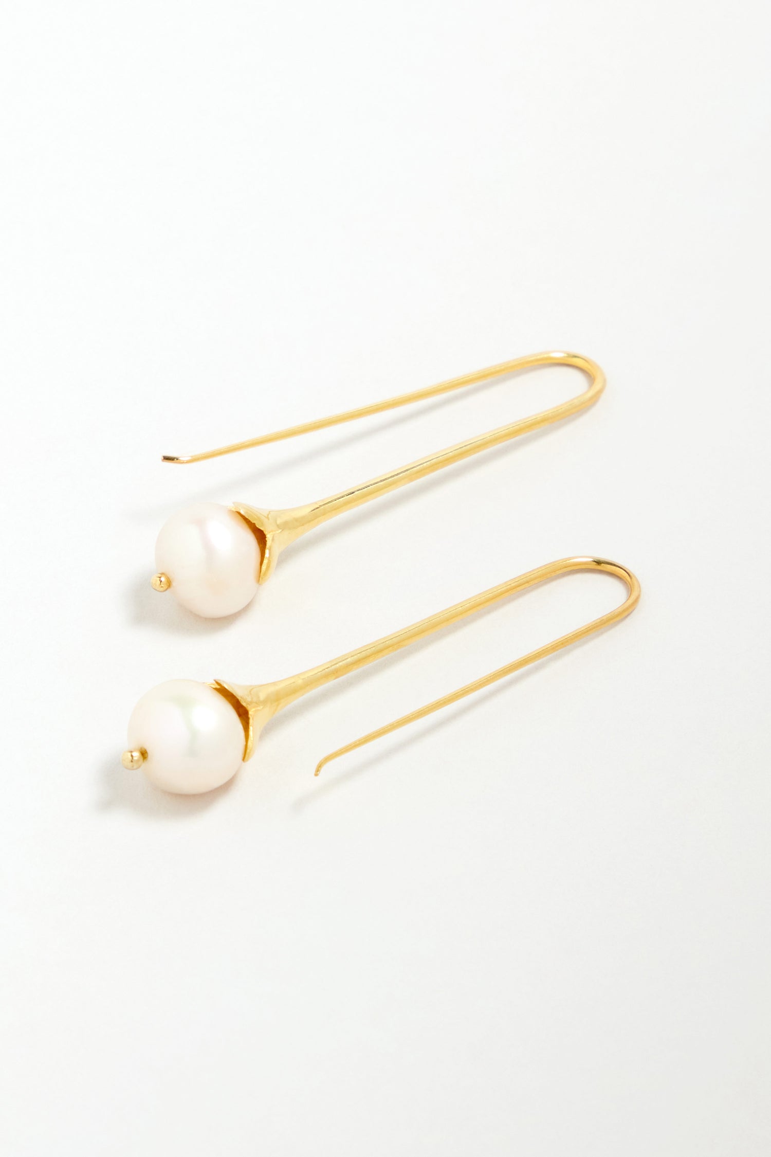 Gold Vermeil Pearl Drop Earrings, each with a single round white pearl, displayed on a plain light background.