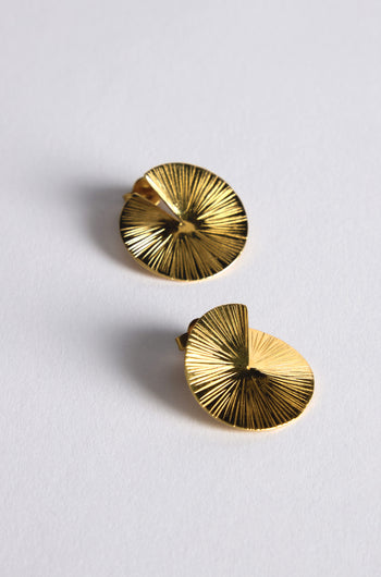 The Small Gold Vermeil Lotus Leaf Earrings are two circular gold pieces with a textured sunburst pattern, displayed on a plain white background.