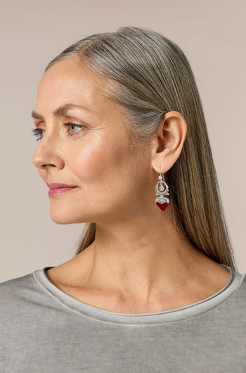 A woman wearing Silver and Carnelian Tuareg Earrings.