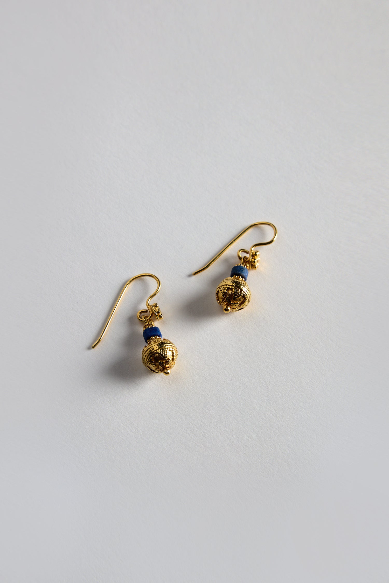 A stunning pair of Gold Vermeil Lapis Bead Earrings with exquisite blue accents, showcased on a light gray background.