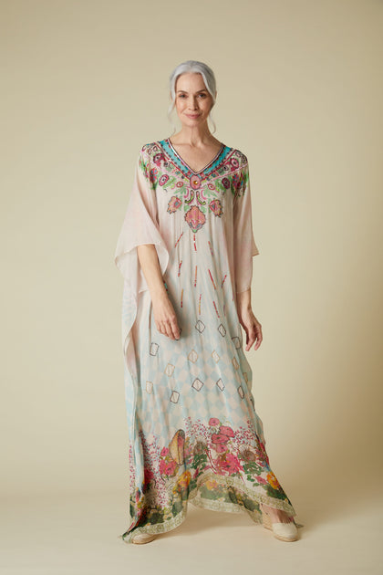 A woman in a lightweight Floral Sequin Kaftan stands against a neutral background.