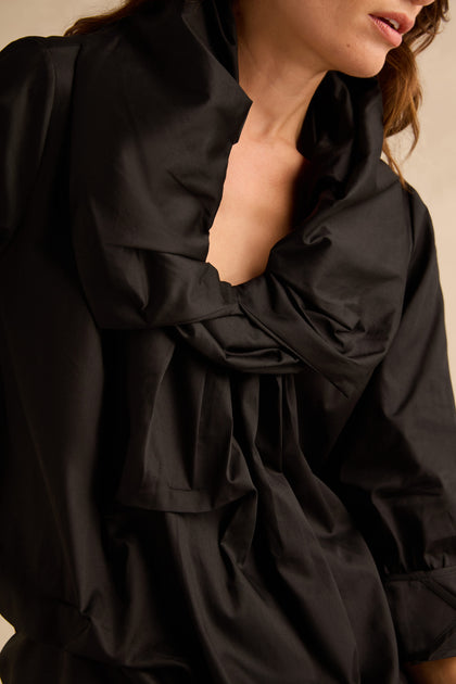 Black Frill Neck Easy Top, a black long-sleeved top featuring a large, pleated frill detail at the neckline.