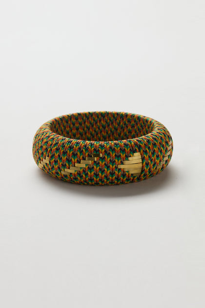 The Handwoven Multicoloured Bangle features a vibrant, multicolored pattern crafted from bright threads, highlighting heritage craftsmanship and shown against a plain white background.