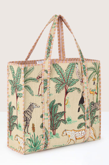 The Jungle Print Tote Bag features a colorful jungle print with animals, trees, and foliage on a large rectangular design. Made with quilted fabric, it also boasts two long, striped handles and a structured form, perfect for carrying your essentials to the Conscious Yoga Collective sessions.