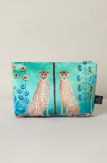 The Large Sunshine Through My Window Velvet Bag showcases a vibrant "Cheetahs Design" with two cheetahs lounging among stylized flowers on a turquoise background.