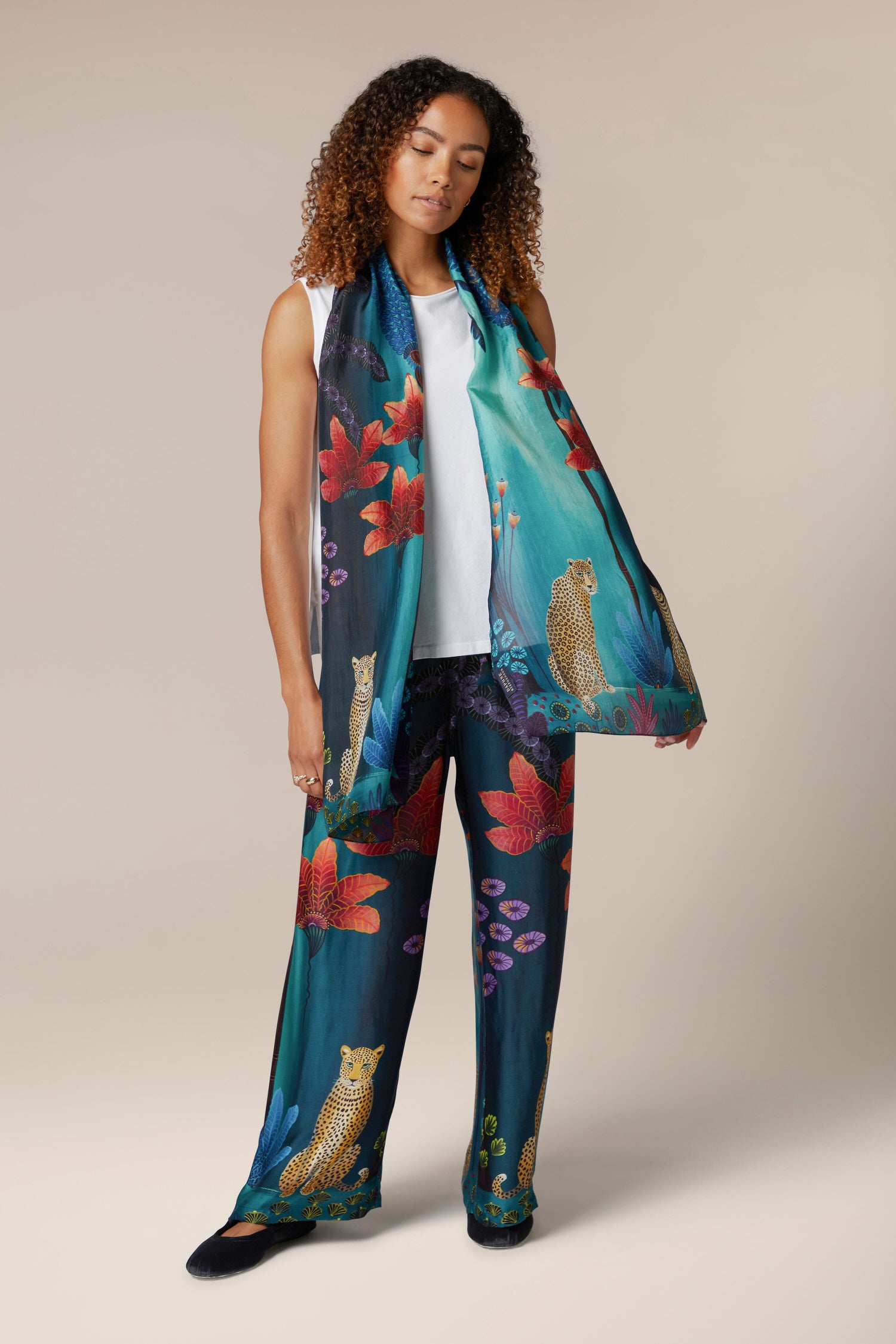 An ethically sourced Twilight Jungle Silk Scarf adorned with a whimsical owl print.