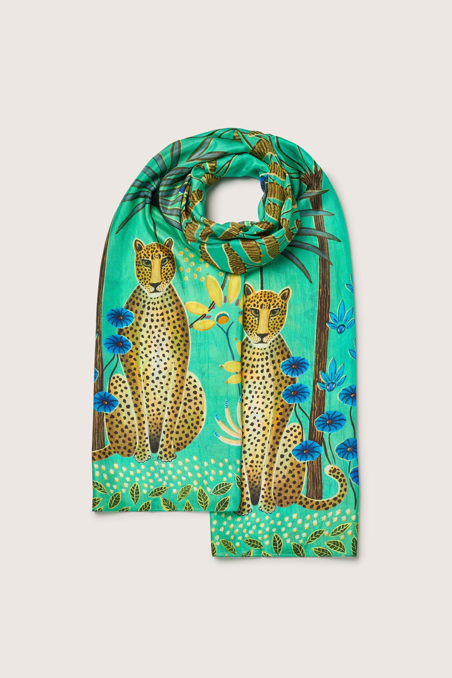 A Leopard in Moonlight silk scarf with cheetahs and tropical scenes adorned with flowers, carefully crafted from ethically sourced materials.