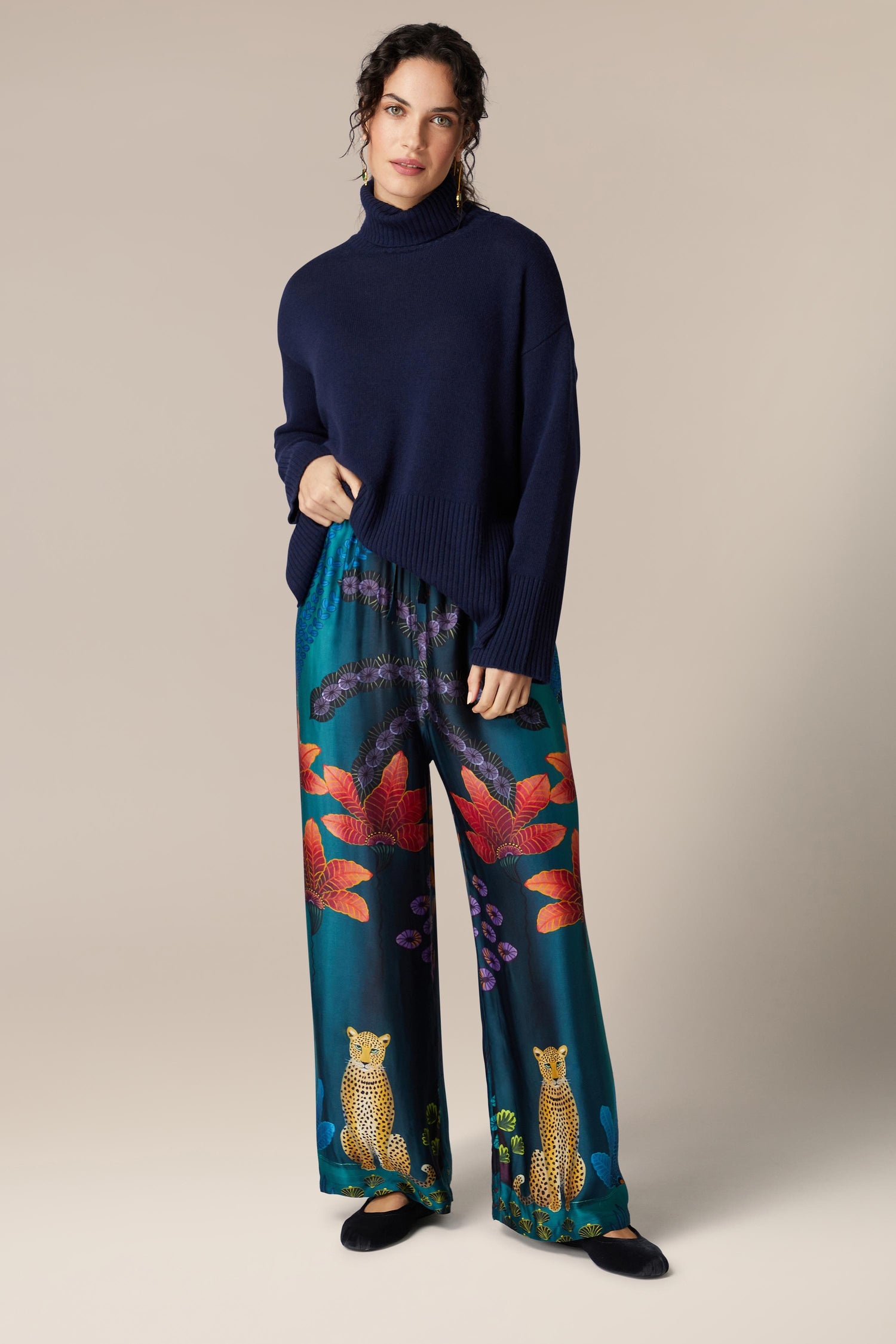 A woman wearing Twilight Jungle Trousers.