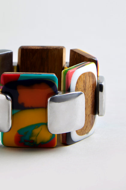 The Colourburst Squares Link Bracelet showcases chunky multicolour resin, natural wood, and silver-toned recycled aluminium rectangular segments in an alternating pattern.